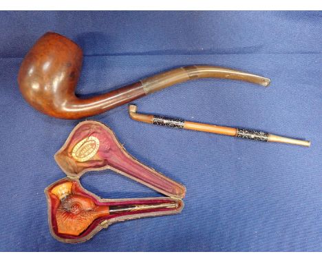 A MEERSCHAUM PIPE, CARVED AS A BIRD, CASED a larger pipe, and a cloisonne decorated opium pipe (3)