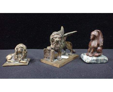 A 19TH CENTURY BRONZE WINGED LION OF St MARK 7.5cm high a bronze sphinx, and a small lion (3)