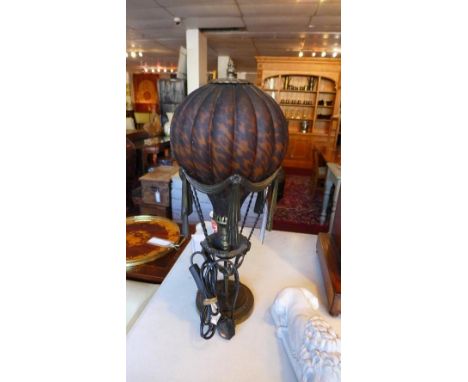 A Maitland Smith table lamp in the form of a hot air balloon, with tortoiseshell effect glass shade 