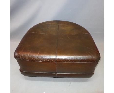 A Contemporary faux black leather pouffe 