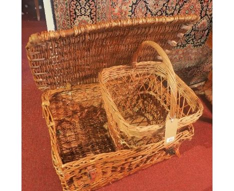 A large vintage picnic hamper, together with one other basket 