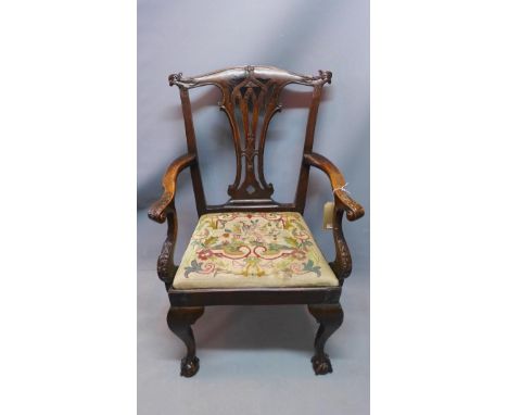 A 19th century Chippendale style armchair, with tapestry upholstered drop in seat, raised on cabriole legs, ball and claw fee