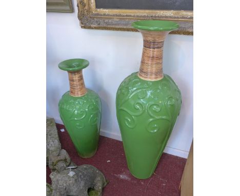 A green glazed ceramic Rumput vase, having swirling floral design and bamboo detailing to neck, H.100cm, together with a matc