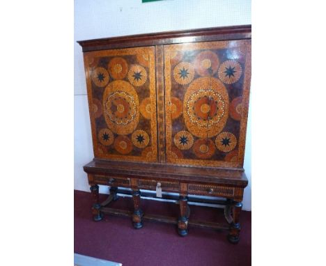 A Dutch Oyster-Veneered Walnut, Ivory, Ebony and marquetry cabinet-on-stand, the rectangular moulded cornice above a pair of 