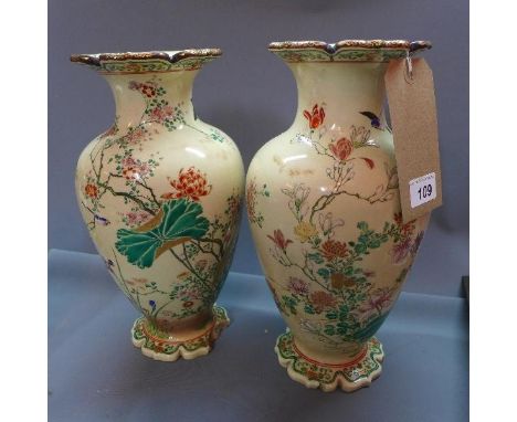 A pair of 19th century Japanese ceramic vases, hand painted with flora and fauna, H.32 cm, (a/f) 