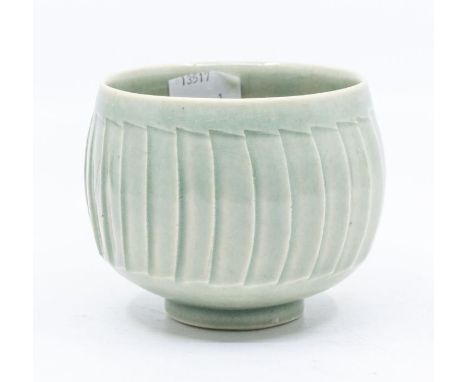 Studio pottery: A David Leach fluted celadon bowl.Condition: Cracks to the body.