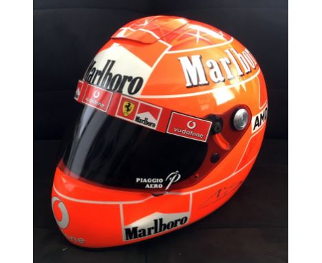 A Michael Schumacher full-sized Ferrari 2004 replica helmet as worn by the seven-times F1 World Champion.