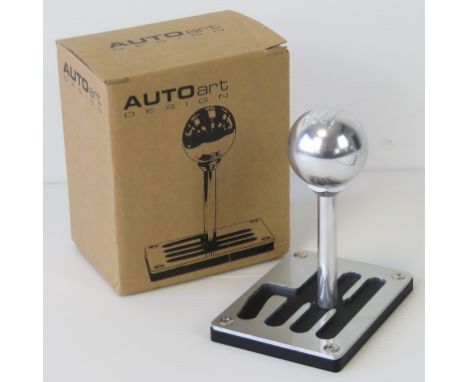 A Ferrari six speed gear stick desk ornament or paperweight, 1:1 scale, and standing 13.5cm high.