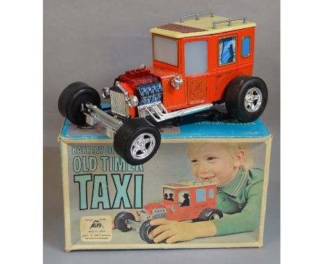 A battery operated 'Old Timer Taxi' by Alps of Japan, of tinplate and plastic construction which comes in a F/G box. The mode