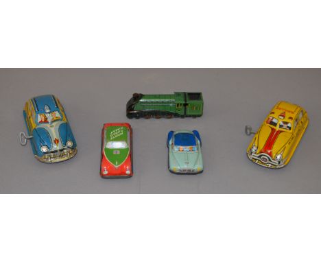 A mixed lot of  unboxed tinplate toys including a Marx Yellow Cab and a 'Woody Wagon', both  G with fixed keys and operationa