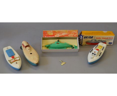 Two boxed Sutcliffe model boats, 'Nautilus Clockwork Submarine' and 'Victor Motor Torpedo Boat' together with two unboxed tin