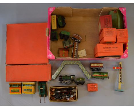 O Gauge. Hornby & Brimtoy 3 x clockwork locomotives together with assorted boxed accessories & unboxed rolling stock. Conditi