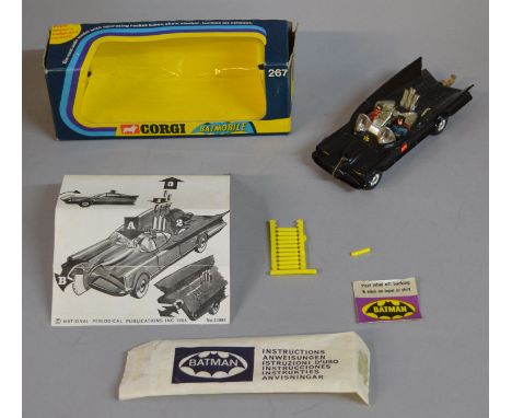 A boxed Corgi Toys 267 'Rocket Firing' Batmobile, the 1973 issue of this model with chrome hubs and clear glass. Batman and R