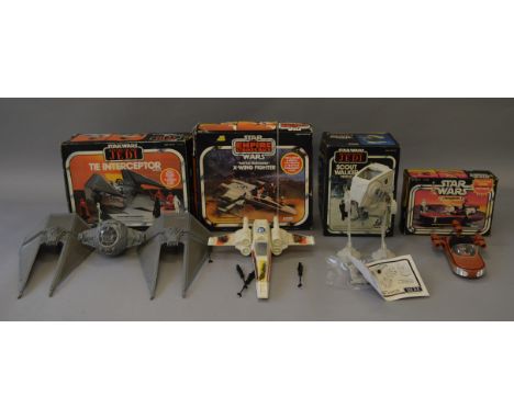 Four vintage Star Wars vehicles: Kenner TIE Interceptor; Palitoy X-Wing Fighter; Kenner Landspeeder; Palitoy Scout Walker. G-