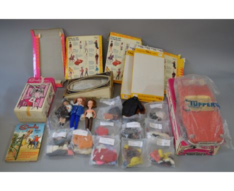 A small collection of Sindy items including a Pedigree Sindy Bed, Wardrobe and Car, all boxed with the latter having warping 