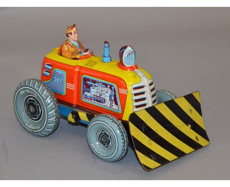 An unboxed Technofix tinplate clockwork Tractor with Shovel, The model has a fixed key and operational mechanism, overall G. 