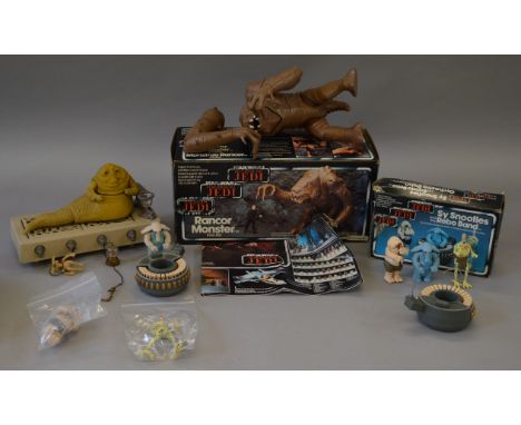 Quantity of vintage Star Wars items: Rancor Monster in tri-logo box, one arm detached; Sy Snootles and the Rebo Band in tri-l