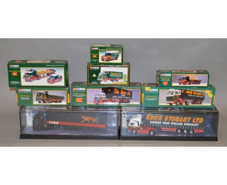 Eight boxed Corgi Eddie Stobart Trucks, three of which have no mirrors present and the 1:50 scale cased truck has damage to m