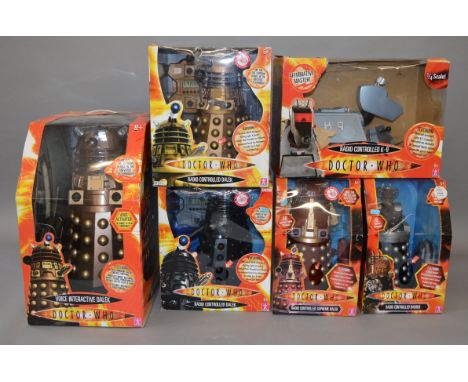 Four different  boxed Dr Who Radio Controlled Dalek models,each approximately 32cm tall,  and a boxed Voice Interactive Dalek