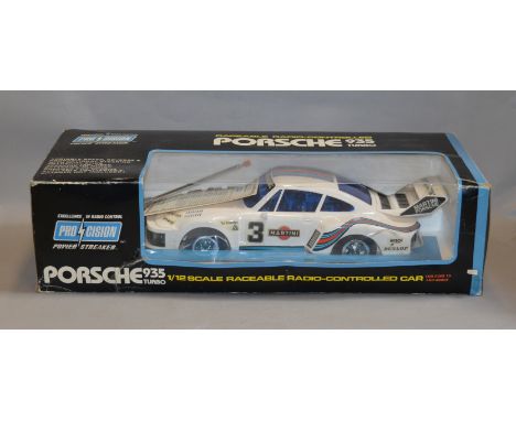 A boxed 'Procision' plastic radio controlled model of a Porsche 935 Turbo in 1:12 scale, although untested,  appears generall