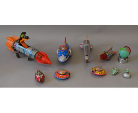 Ten unboxed tinplate and plastic space related toys in a variety of different scales, including both Chinese and Japanese exa