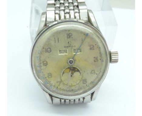 An Omega moonphase triple-date wristwatch on an Omega bracelet strap, a/f, with Tissot button