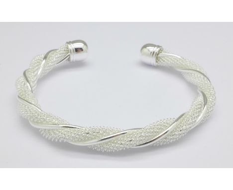 A silver torque bangle, 17g
