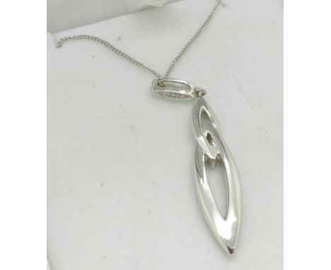 A 9ct white gold and diamond pendant and chain