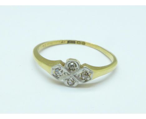 An 18ct gold and four stone diamond ring, mark worn, 2.2g, O