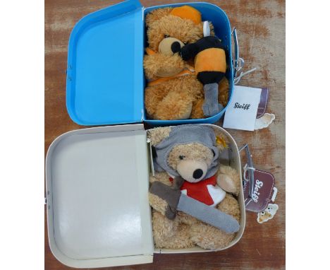 Two Steiff Teddy bears in suitcases