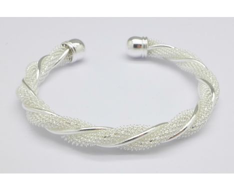 A silver torque bangle, 17g