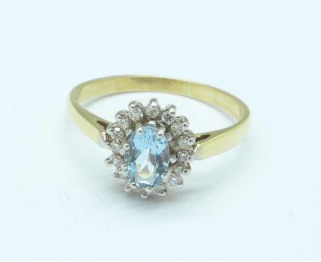 A yellow metal, aquamarine and diamond cluster ring, 1.8g, N