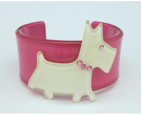 A lucite dog bangle, height of dog 5cm