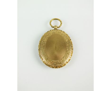 A Victorian oval locket, with carved floral scroll border and bright cut and engine turned decoration, the hinged cover openi