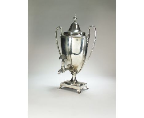 A George III silver tea urn, Henry Chawner, London 1791, of typical form with two elongated reeded handles, the removable cov