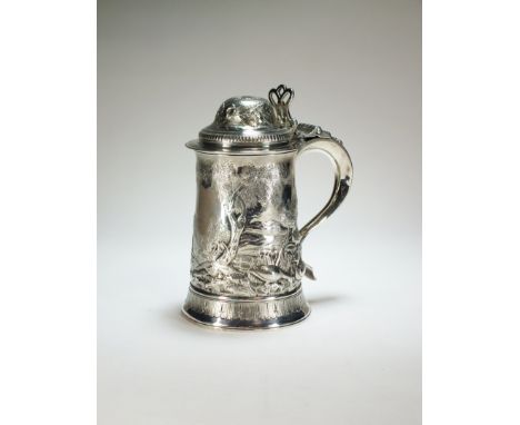 A George III silver tankard, R E, London 1796, of tapered form with embossed animal hunting scene, the domed hinged cover wit