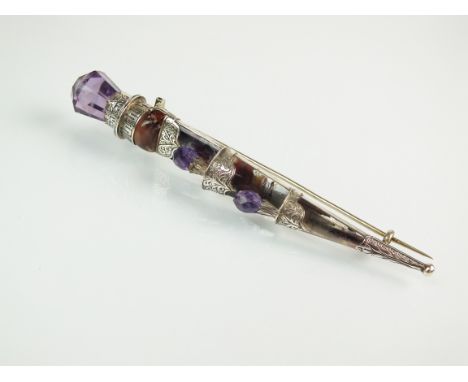 A Scottish amethyst and rock crystal set dirk pin, with quartz set sheath and faceted amethyst thistle finials, all mounted i