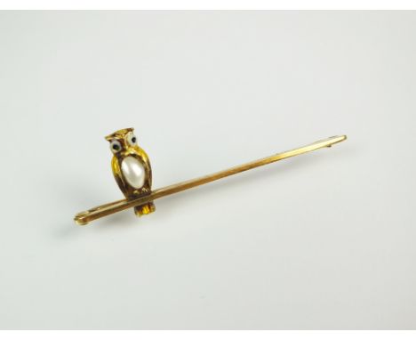 A late 19th century blister pearl and enamel owl bar brooch, the yellow metal owl with pearl set body and enamelled eyes, mou