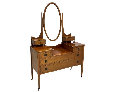 Edwardian inlaid mahogany dressing table, oval swing mirror, trinket drawers, above two small and two long drawersDimensions: