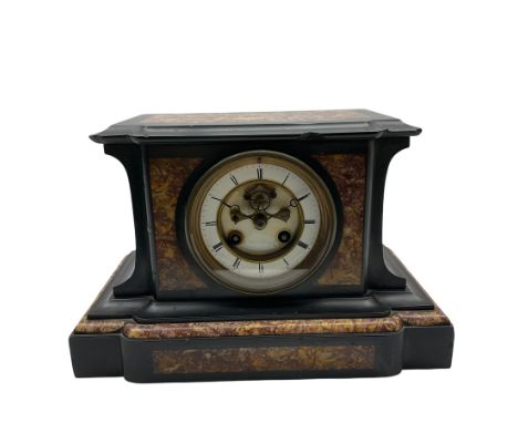 A French eight day striking mantle clock in a Belgium slate case with panels of contrasting variegated marble to the top and 