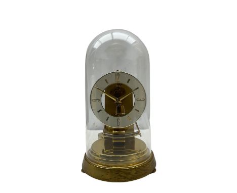 A late 20th century German Kieninger &amp; Obergfell,&nbsp;“Kundo” battery operated mantle clock under an acrylic shade, with