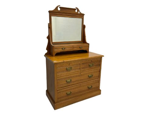 Late 19th century satin walnut dressing chest, rectangular bevelled swing mirror with two small trinket drawers, the chest fi