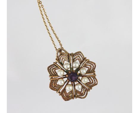 An amethyst and untested pearl set pendant, the star shaped pendant set with central amethyst and eight untested pearls, unma
