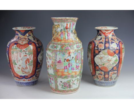 A late 19th century Cantonese famille rose vase, decorated with figures in gardens and flowers, 36cm, with a pair of Japanese