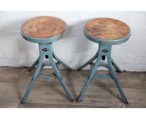 A pair of industrial laboratory stools by 'D. Mathews & Son' Liverpool, adjustable seats with wood inserts, lithograph makers