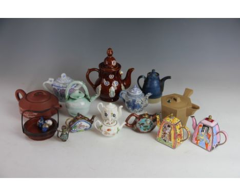 A collection of miniature tea pots, to include two Chinese red ware tea pots, a Cantonese enamel example, a cloisonne example