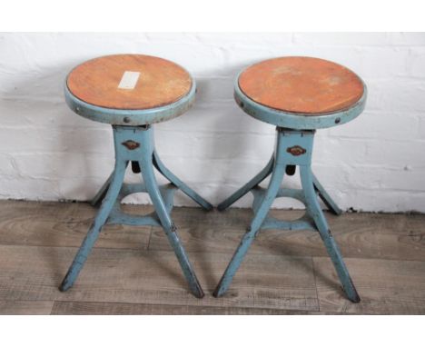 A pair of industrial laboratory stools by 'D. Mathews & Son' Liverpool, adjustable seats with wood inserts, lithograph makers