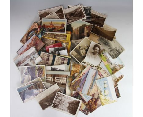 A large collection of Edwardian and later postcards, including many family portraiture and British and Continental landscapes