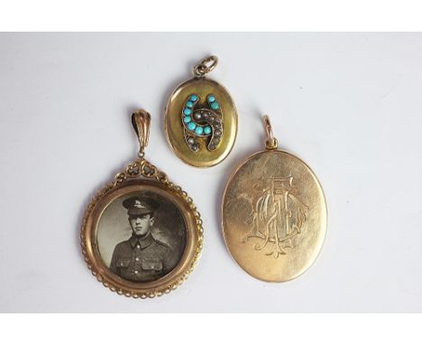 A yellow metal oval locket, monogrammed, stamped '15', weight 15.1gms, along with a seed pearl and turquoise set oval locket 