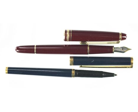 A Montblanc Meisterstuck fountain pen, in burgundy with 14K nib, and a Dupont de Paris 925 gilt mounted fibre pen, Number B7E